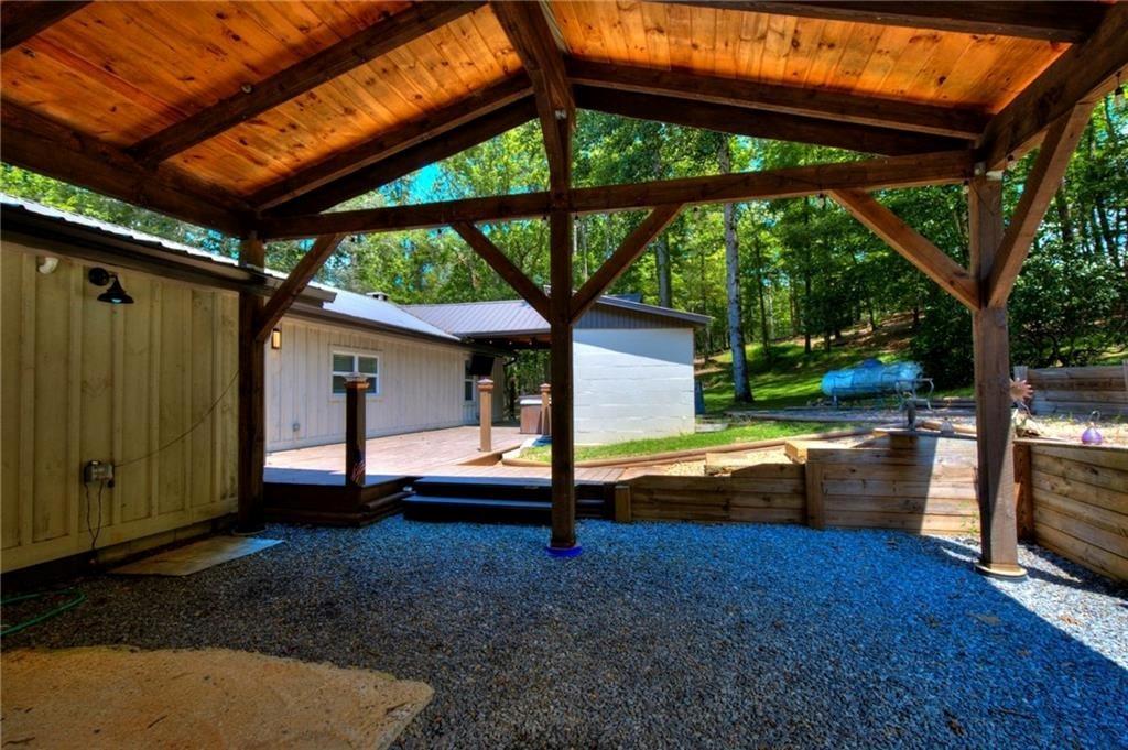 18131 Morganton Highway Morganton, GA 30560 - Photo 27 of 71 a view of backyard with tub and wooden fence