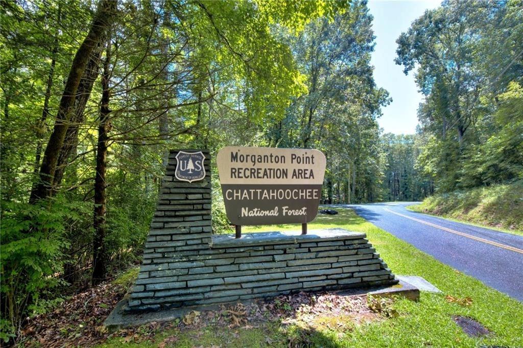 18131 Morganton Highway Morganton, GA 30560 - Photo 60 of 71 a sign that is sitting on a wooden bench