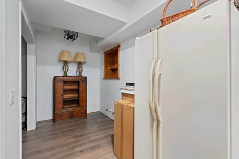 a view of kitchen and wooden floor