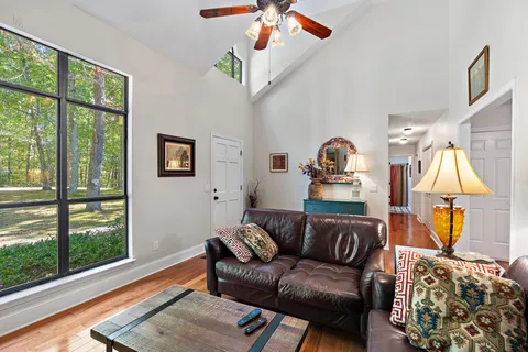 a living room with furniture a couch and a window