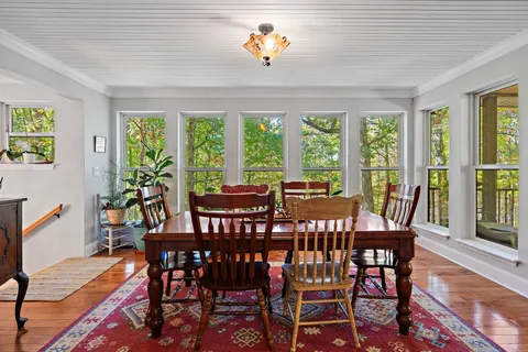 a view of a dining room with furniture window and outside view