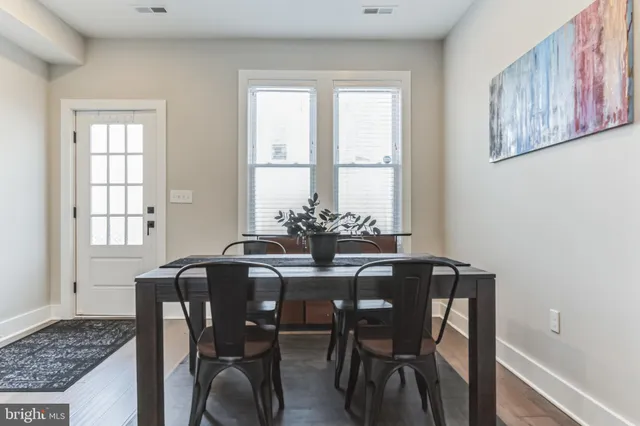 a view of a dining room with furniture and window