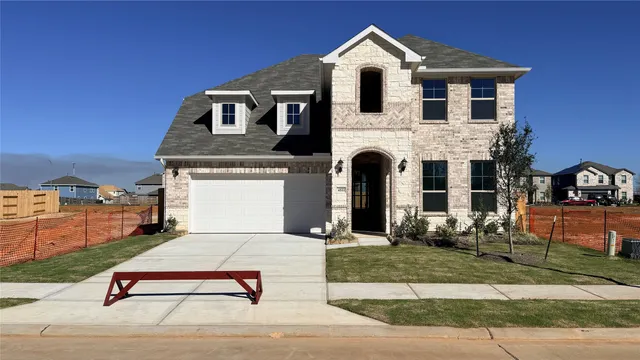 a kitchen with kitchen island a sink stainless steel appliances and cabinets