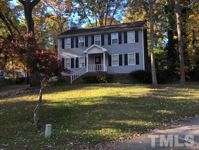 2804 Steeplechase Court Raleigh, NC 27613 - Photo 2 of 41 a front view of a house with a yard