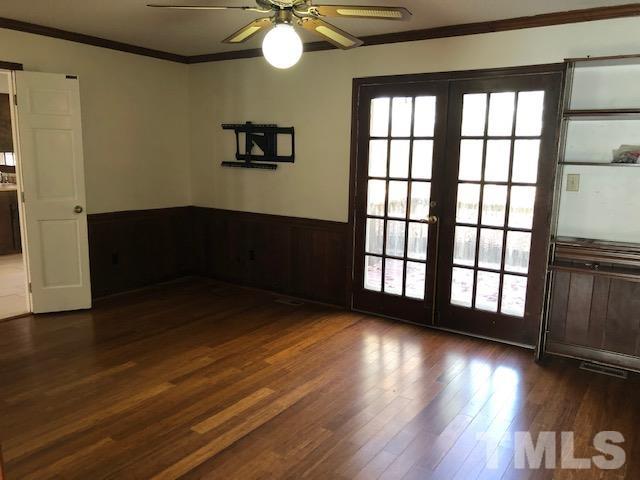 2804 Steeplechase Court Raleigh, NC 27613 - Photo 12 of 41 a view of an empty room with wooden floor and a window