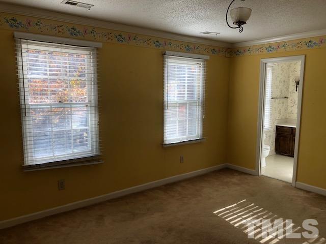 2804 Steeplechase Court Raleigh, NC 27613 - Photo 19 of 41 an empty room with windows