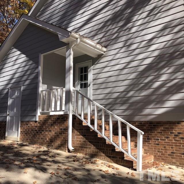 2804 Steeplechase Court Raleigh, NC 27613 - Photo 3 of 41 a view of a house with wooden stairs