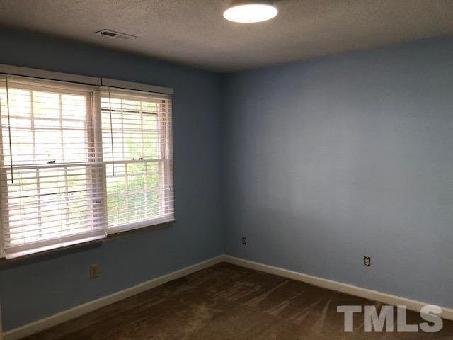 2804 Steeplechase Court Raleigh, NC 27613 - Photo 22 of 41 a view of an empty room with a window