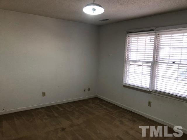 2804 Steeplechase Court Raleigh, NC 27613 - Photo 26 of 41 an empty room with a window