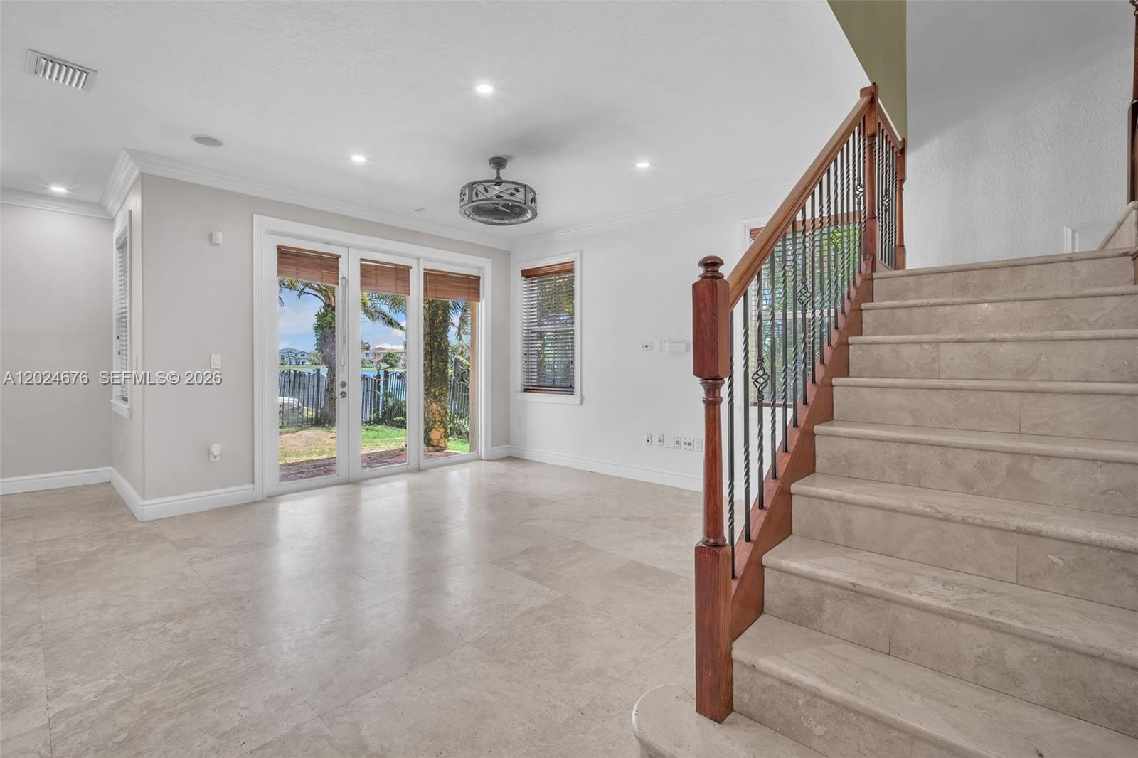 2155 Southwest 156th Court Miami, FL 33185 - Photo 7 of 57 a view of an entryway with wooden floor and windows