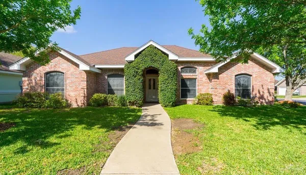 a view of a front of a house with a yard