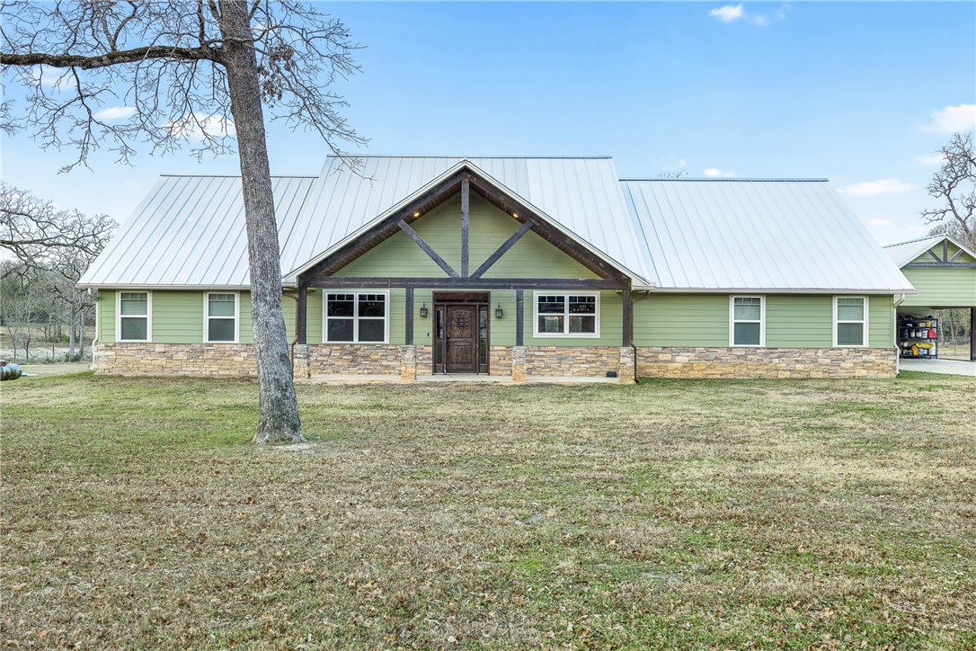 7440 Fm 39 Road South North Zulch, TX 77872 - Photo 3 of 50 a front view of a house with a garden