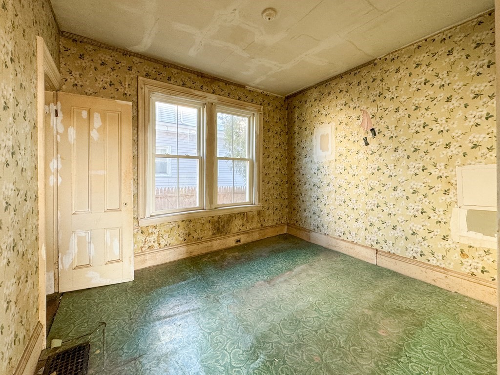 64 Braeburn Road Boston, MA 02136 - Photo 15 of 23 a view of an empty room with a window