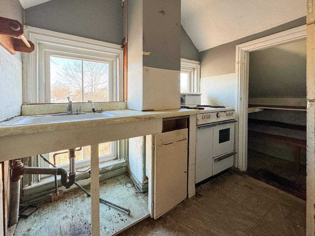 64 Braeburn Road Boston, MA 02136 - Photo 17 of 23 a kitchen that has a stove and a microwave