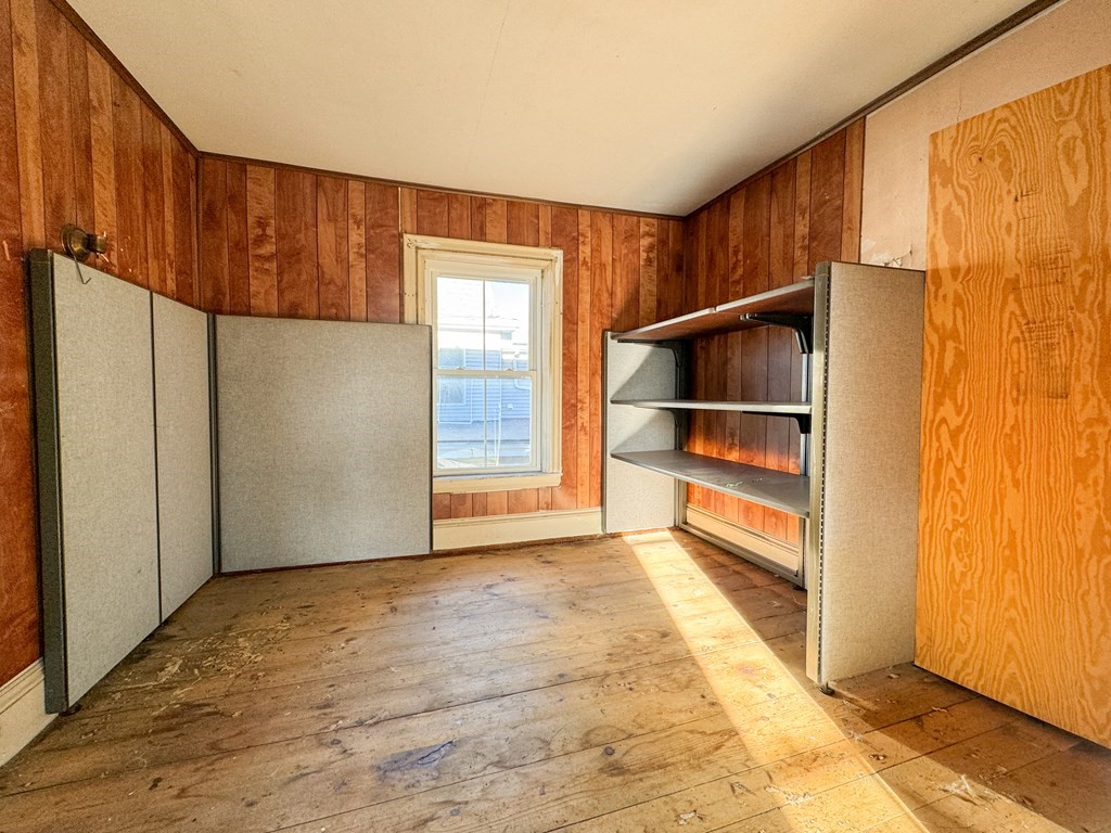 64 Braeburn Road Boston, MA 02136 - Photo 20 of 23 a view of an empty room with wooden floor and a window
