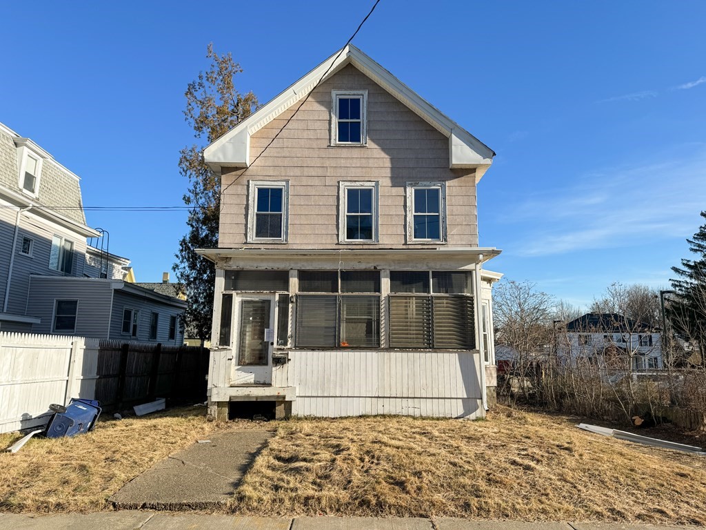 64 Braeburn Road Boston, MA 02136 - Photo 2 of 23 a view of a white house with large windows and wooden fence