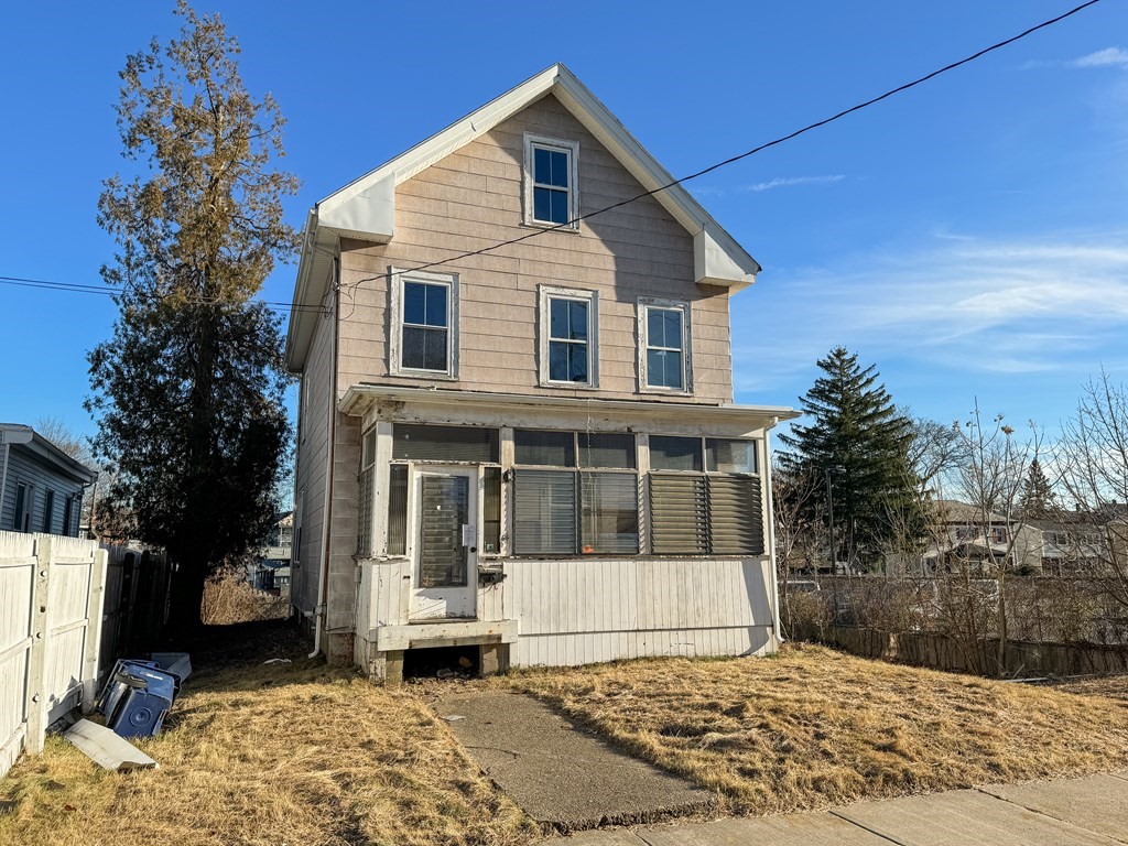 64 Braeburn Road Boston, MA 02136 - Photo 3 of 23 a front view of a house with a yard