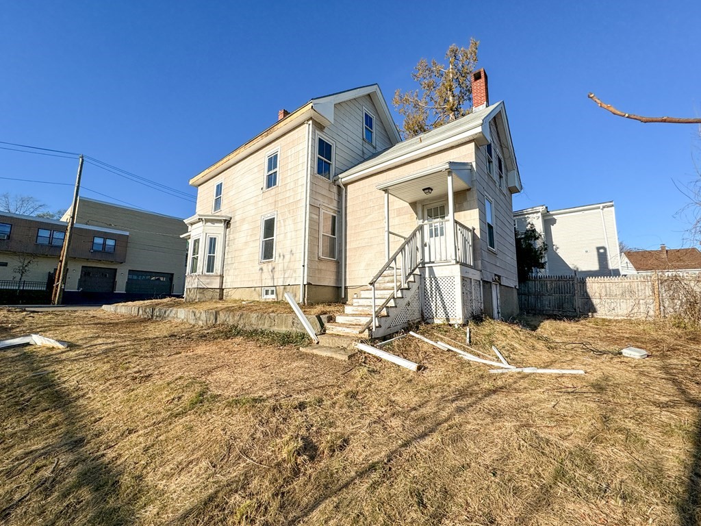 64 Braeburn Road Boston, MA 02136 - Photo 6 of 23 a view of a house with snow on the background