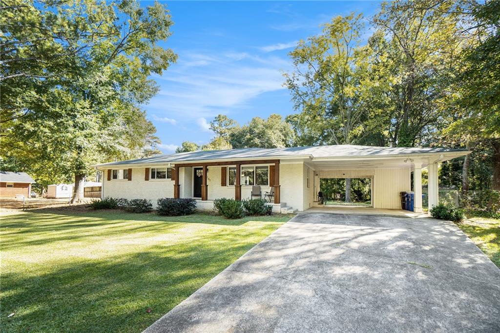 4201 Springdale Circle Powder Springs, GA 30127 - Photo 1 of 1 a view of a house with a big yard and palm trees