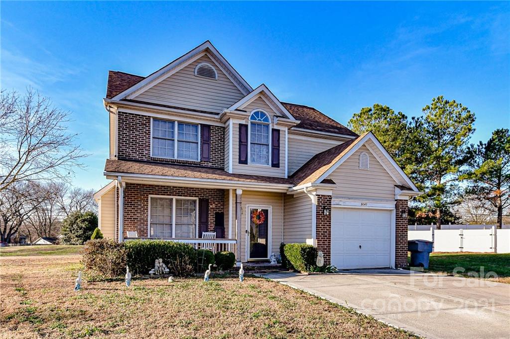9043 Silver Coach Lane Charlotte, NC 28273 - Photo 2 of 32 a front view of a house with garden
