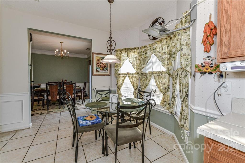 9043 Silver Coach Lane Charlotte, NC 28273 - Photo 12 of 32 a outdoor space with lots of chairs and a chandelier