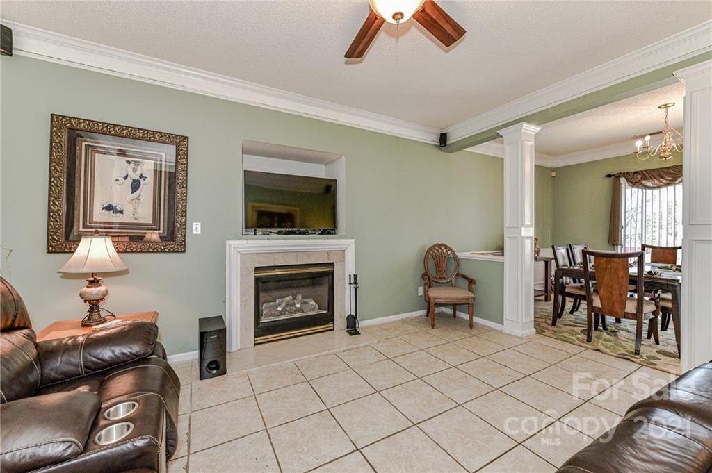9043 Silver Coach Lane Charlotte, NC 28273 - Photo 14 of 32 a living room with furniture and a fireplace