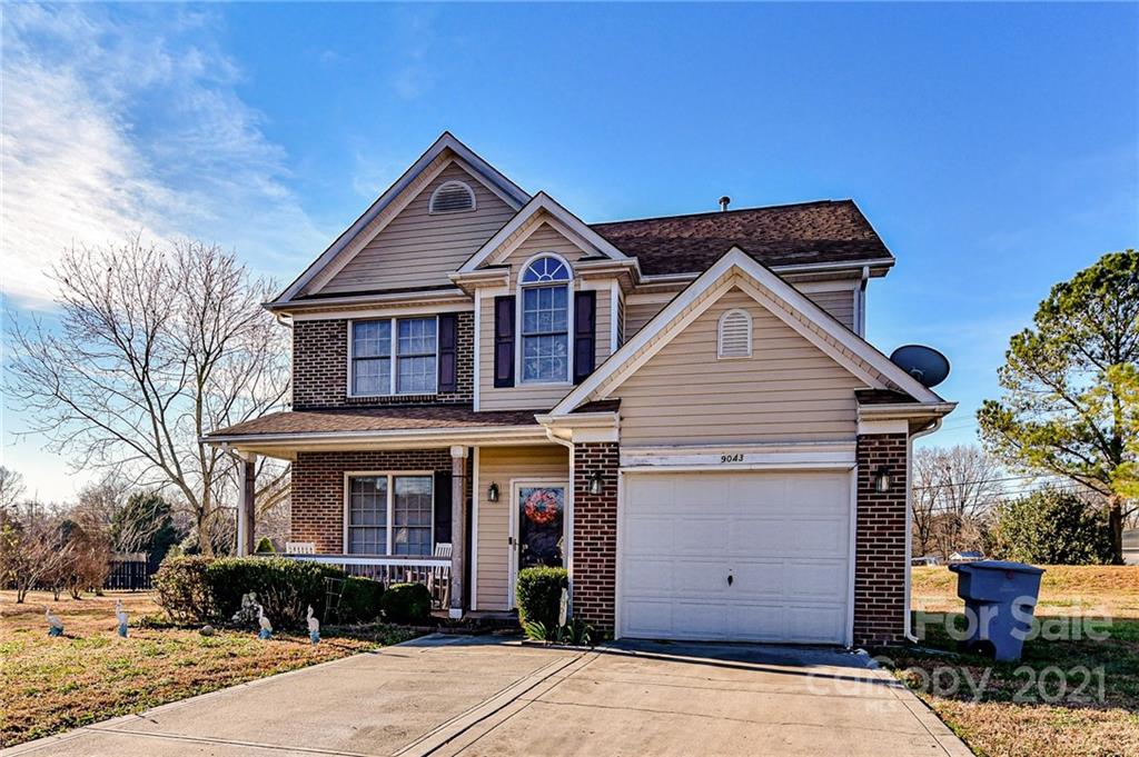 9043 Silver Coach Lane Charlotte, NC 28273 - Photo 3 of 32 a view of a house with a yard