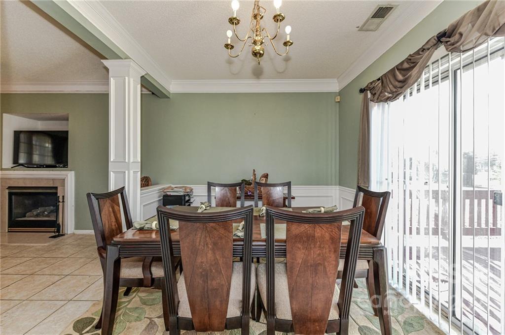 9043 Silver Coach Lane Charlotte, NC 28273 - Photo 7 of 32 a view of a dining room with furniture window and outside view