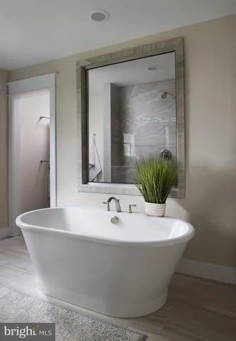 a white bath tub sitting in a bathroom