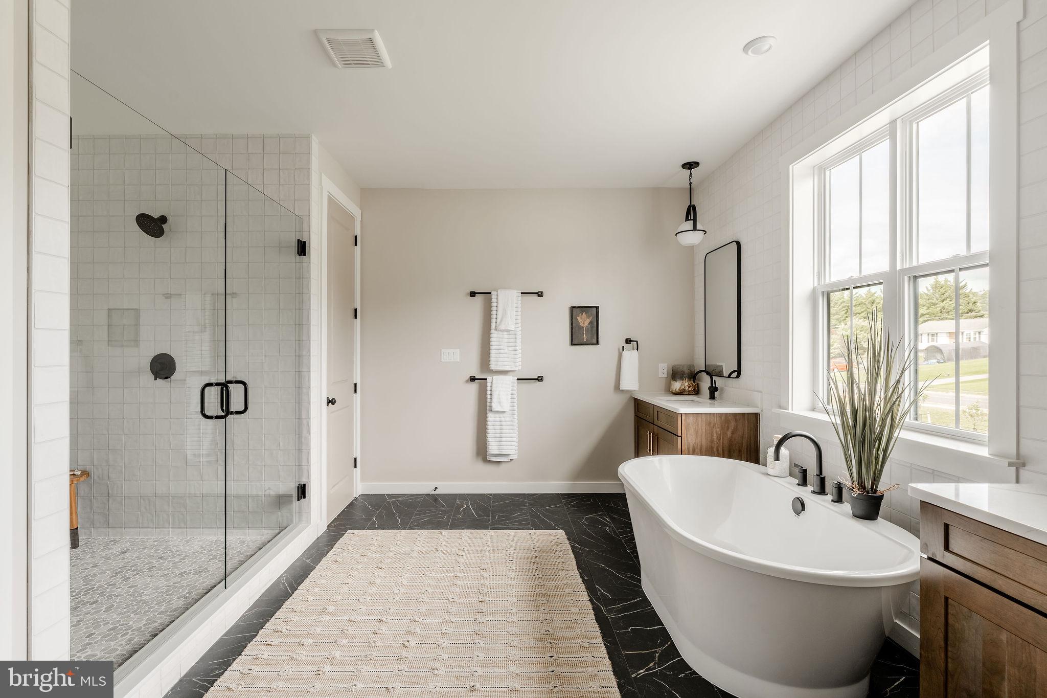 707007728 Hook Road, Unit COVINGTON Westminster, MD 21157 - Photo 40 of 48 a spacious bathroom with a bathtub and a shower