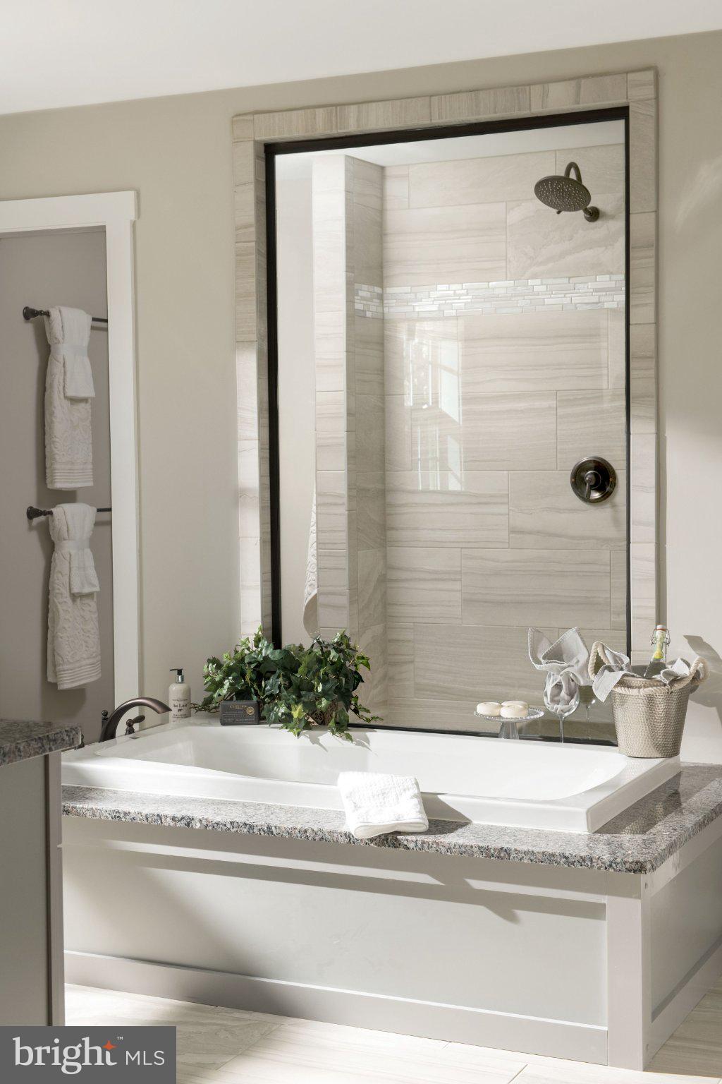 707007728 Hook Road, Unit COVINGTON Westminster, MD 21157 - Photo 43 of 48 a bathroom with a granite countertop sink and a mirror