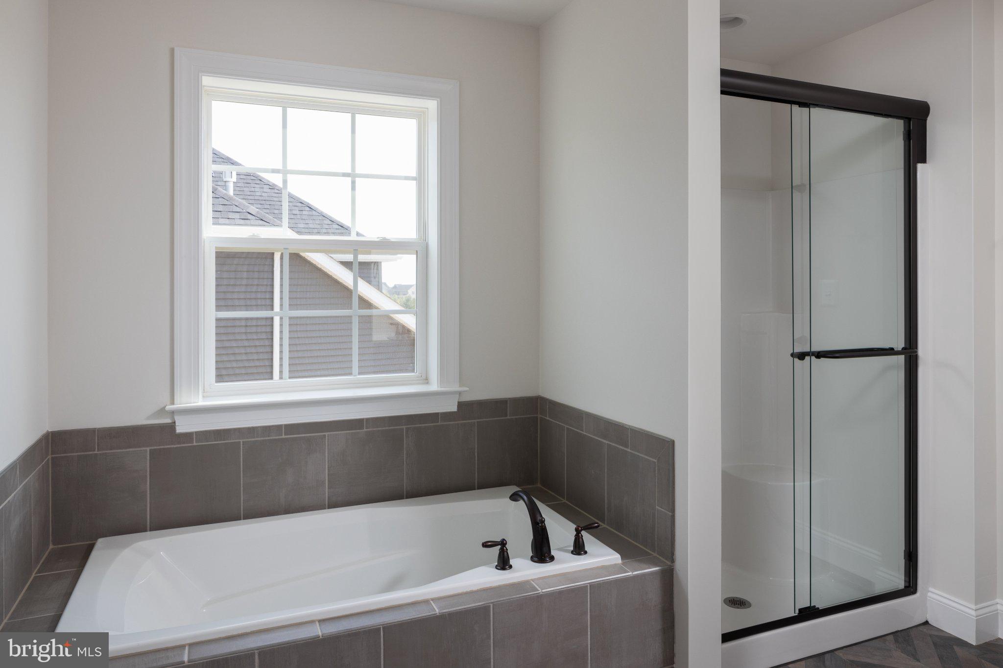 707007728 Hook Road, Unit COVINGTON Westminster, MD 21157 - Photo 44 of 48 a bathroom with a bathtub