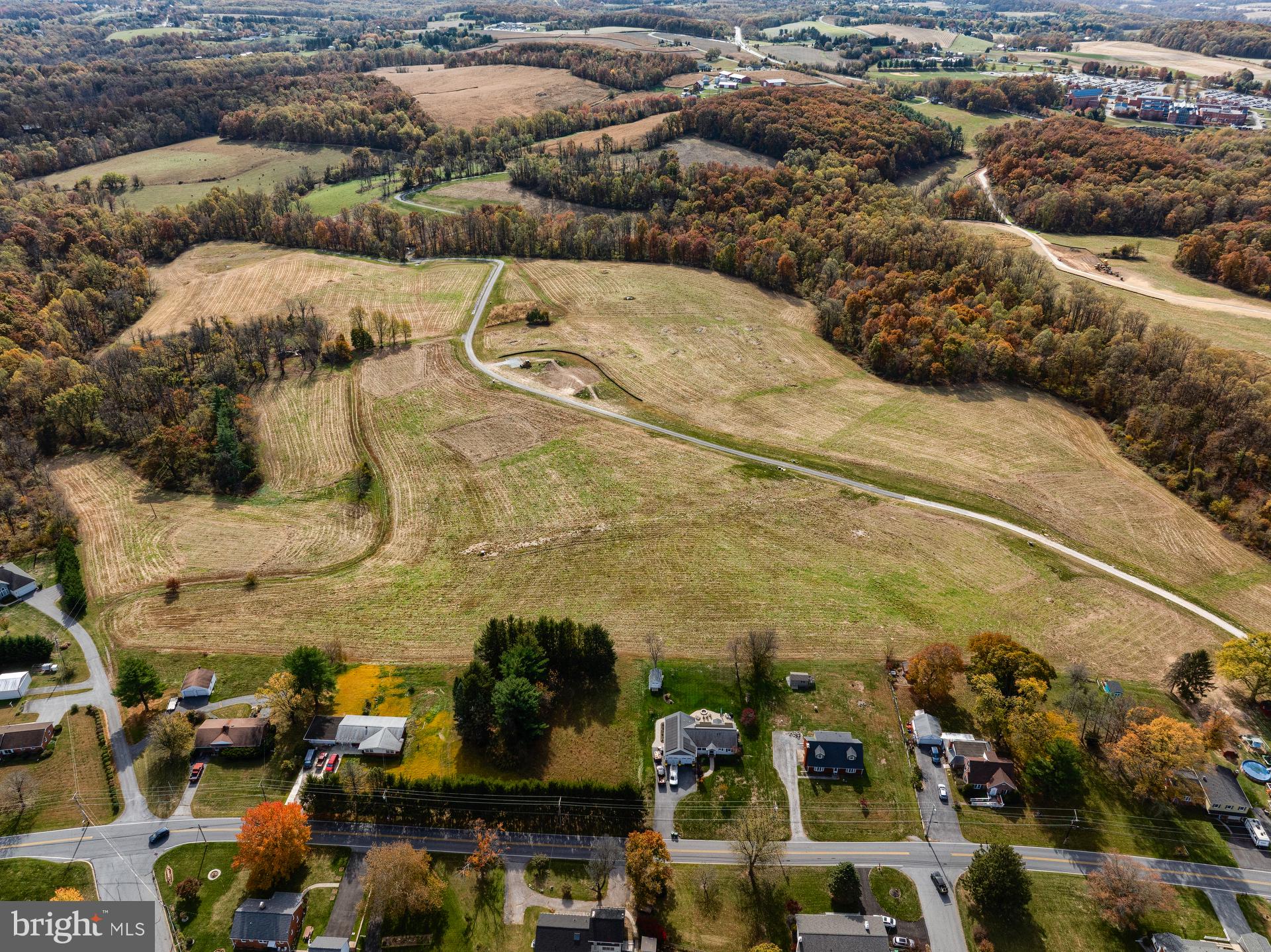 707007728 Hook Road, Unit COVINGTON Westminster, MD 21157 - Photo 48 of 48 an aerial view of residential houses with outdoor space