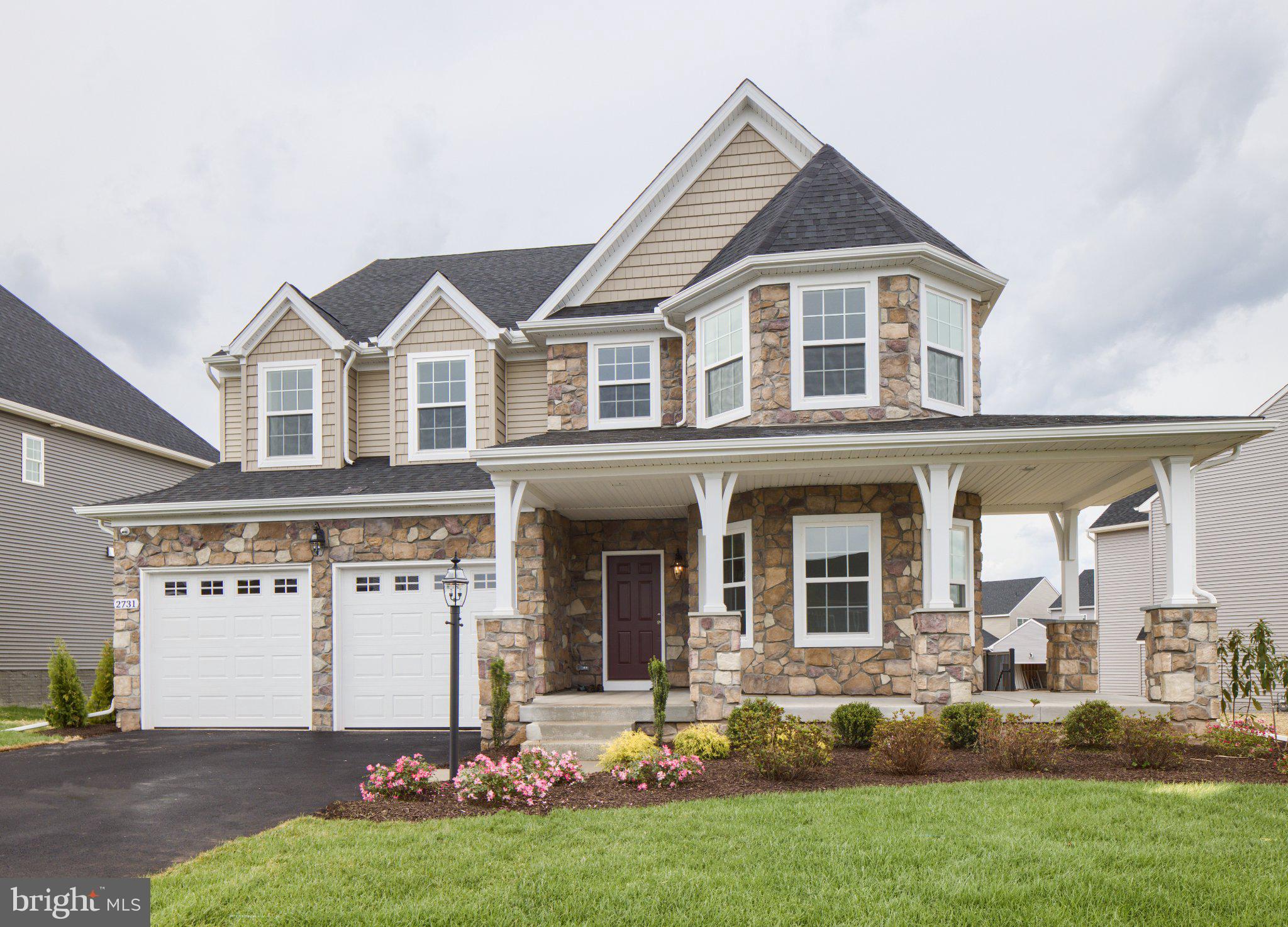707007728 Hook Road, Unit COVINGTON Westminster, MD 21157 - Photo 9 of 48 a front view of a house with a yard