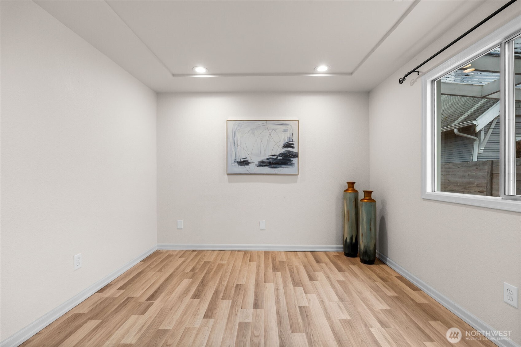 3215 North Tyler Street Tacoma, WA 98407 - Photo 13 of 40 a view of a room with wooden floor and a window