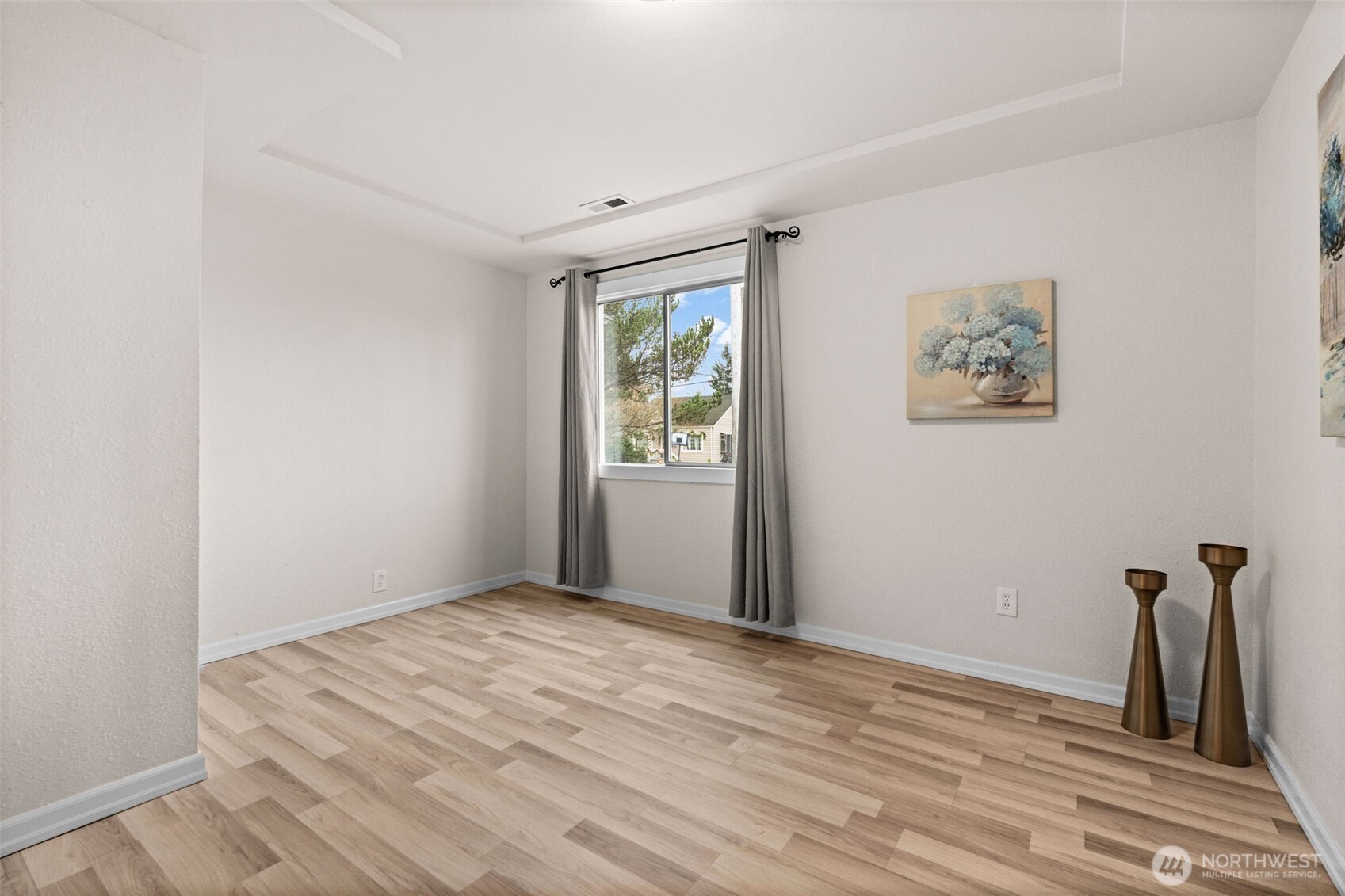 3215 North Tyler Street Tacoma, WA 98407 - Photo 18 of 40 an empty room with wooden floor and windows