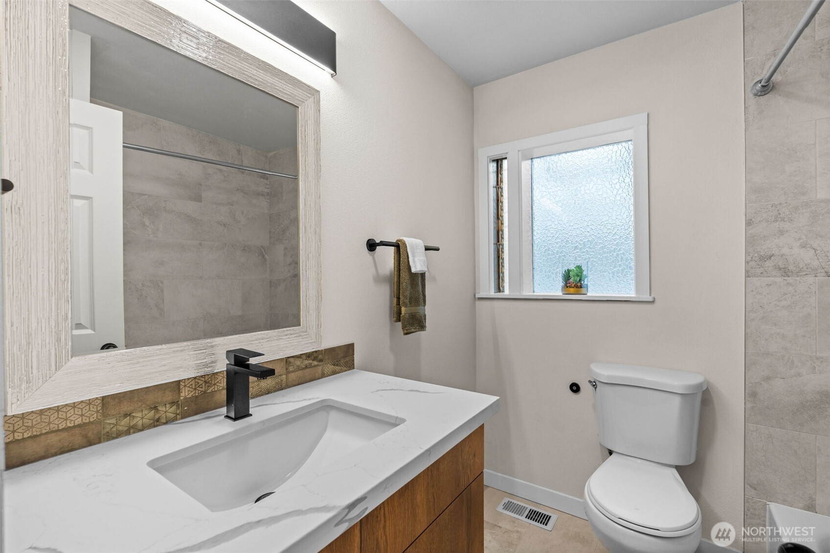 3215 North Tyler Street Tacoma, WA 98407 - Photo 19 of 40 a bathroom with a toilet sink and mirror