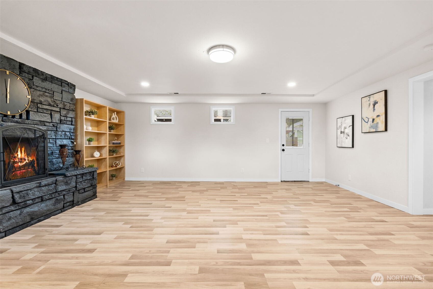 3215 North Tyler Street Tacoma, WA 98407 - Photo 21 of 40 a view of empty room with a flat screen tv and a fireplace