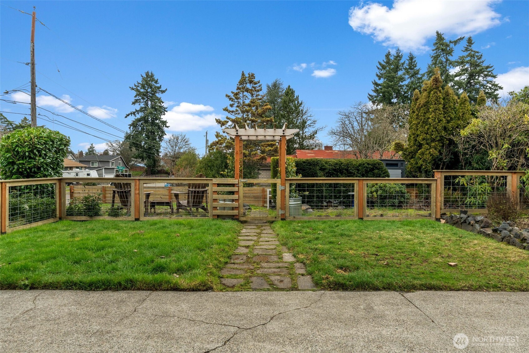 3215 North Tyler Street Tacoma, WA 98407 - Photo 33 of 40 a view of a garden with a bench