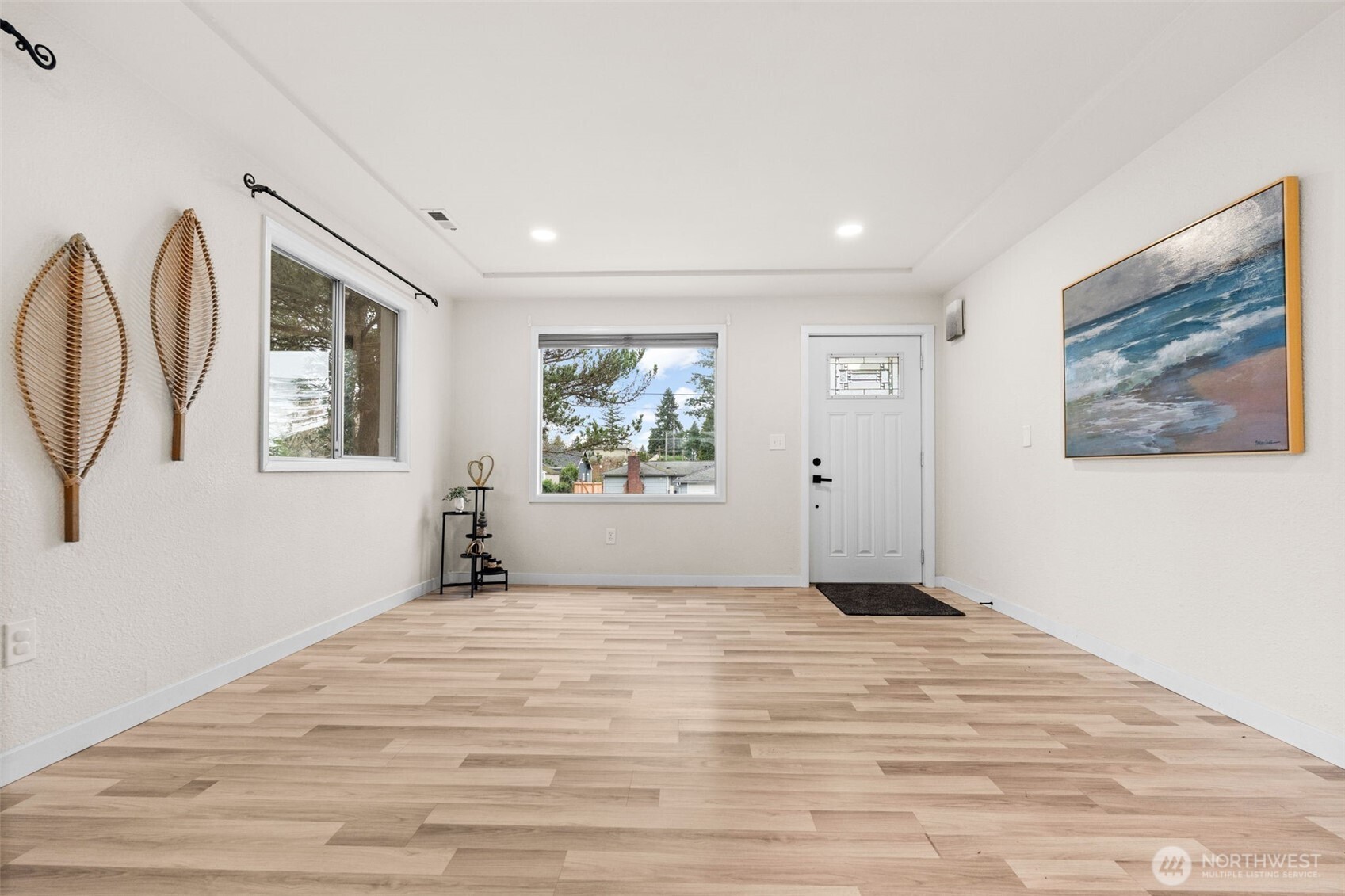 3215 North Tyler Street Tacoma, WA 98407 - Photo 4 of 40 a view of a bedroom with wooden floor and window