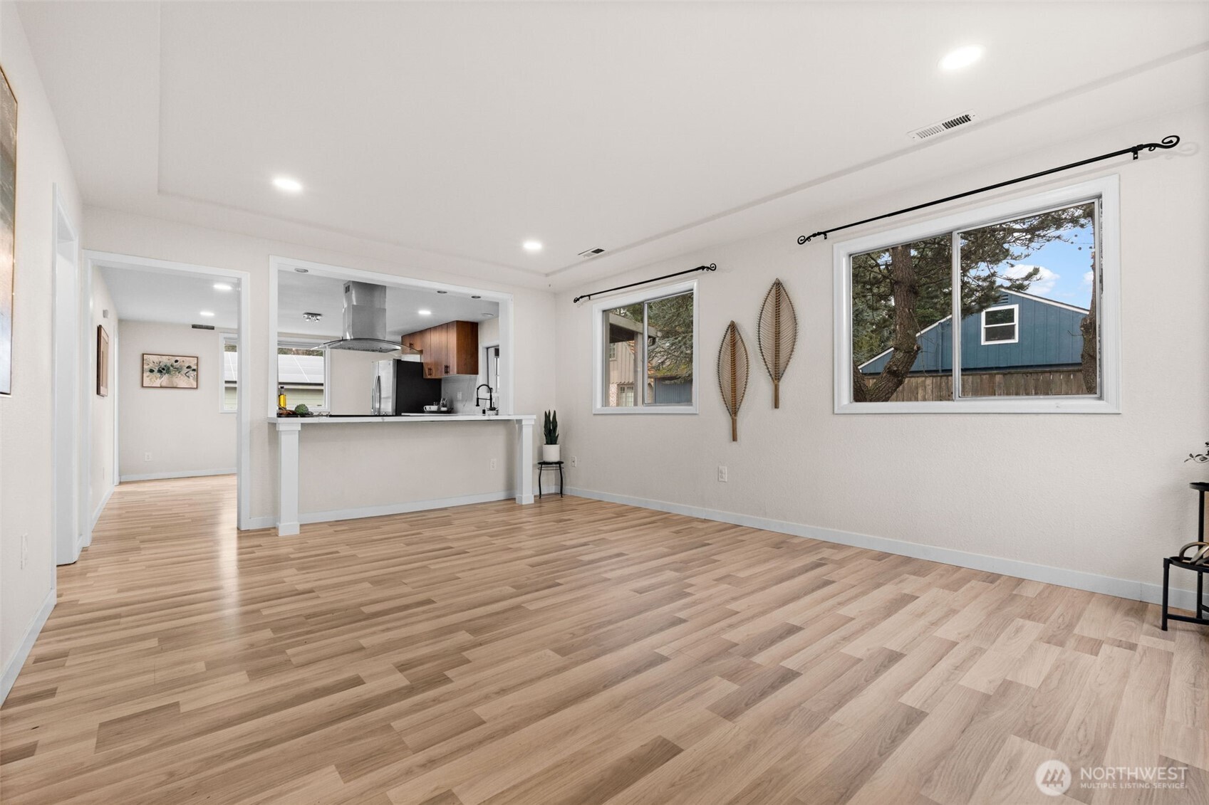 3215 North Tyler Street Tacoma, WA 98407 - Photo 5 of 40 a view of a kitchen with wooden floor and a window