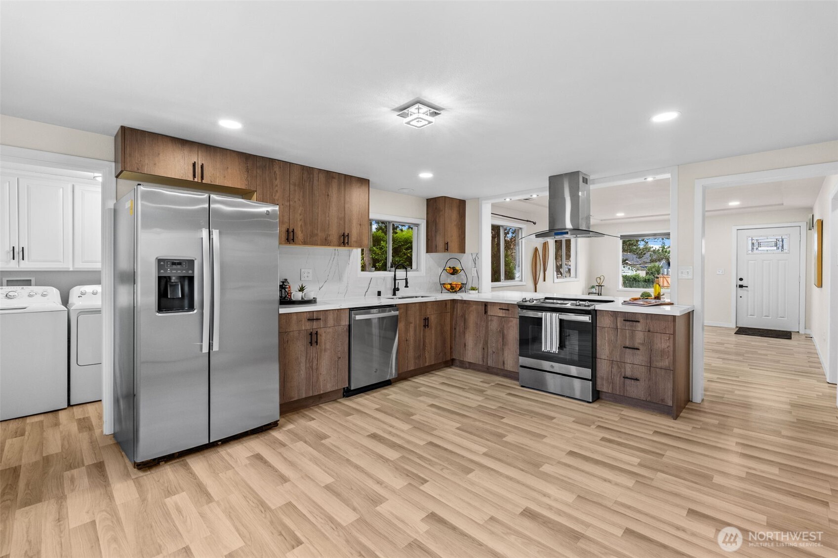 3215 North Tyler Street Tacoma, WA 98407 - Photo 7 of 40 a kitchen with stainless steel appliances a sink and a refrigerator
