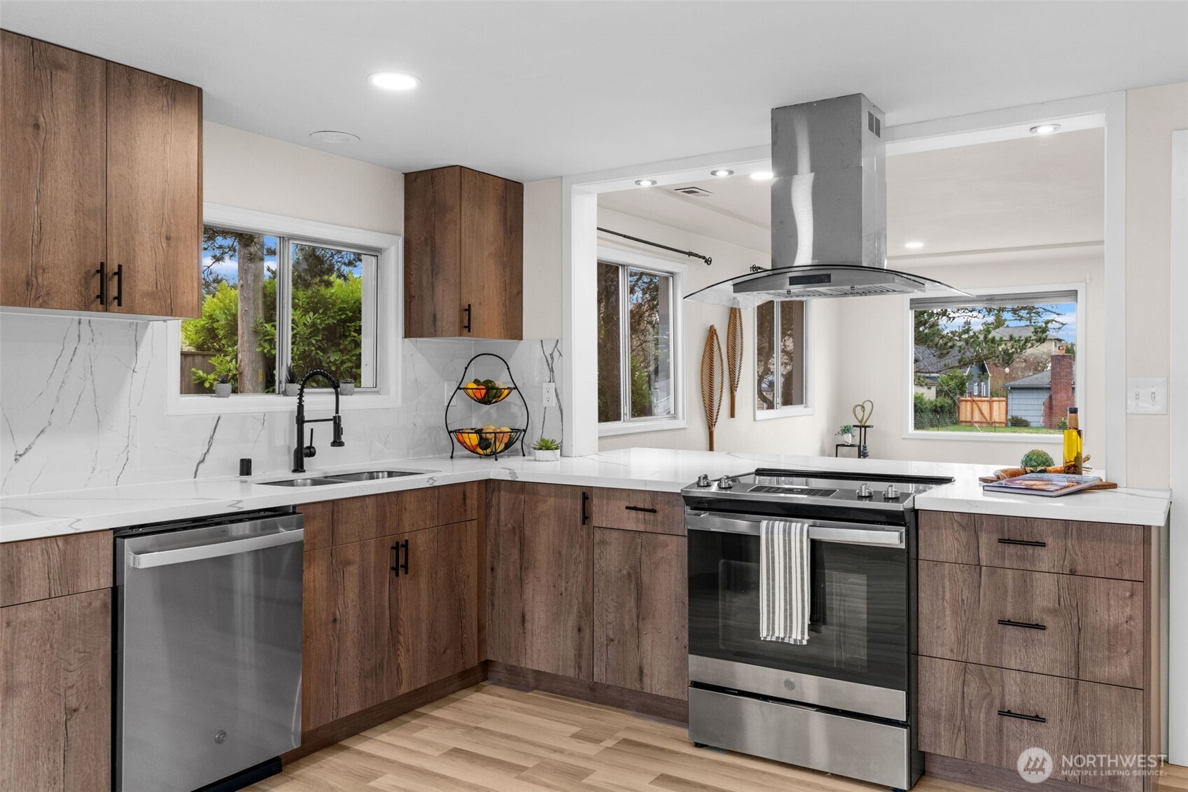 3215 North Tyler Street Tacoma, WA 98407 - Photo 8 of 40 a kitchen with a sink stove and cabinets