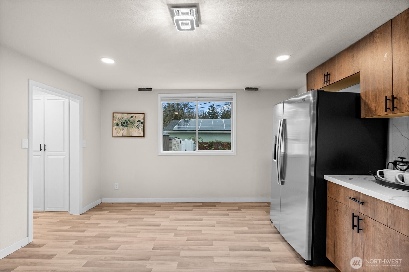 3215 North Tyler Street Tacoma, WA 98407 - Photo 10 of 40 a view of kitchen with stainless steel appliances a refrigerator and a stove top oven