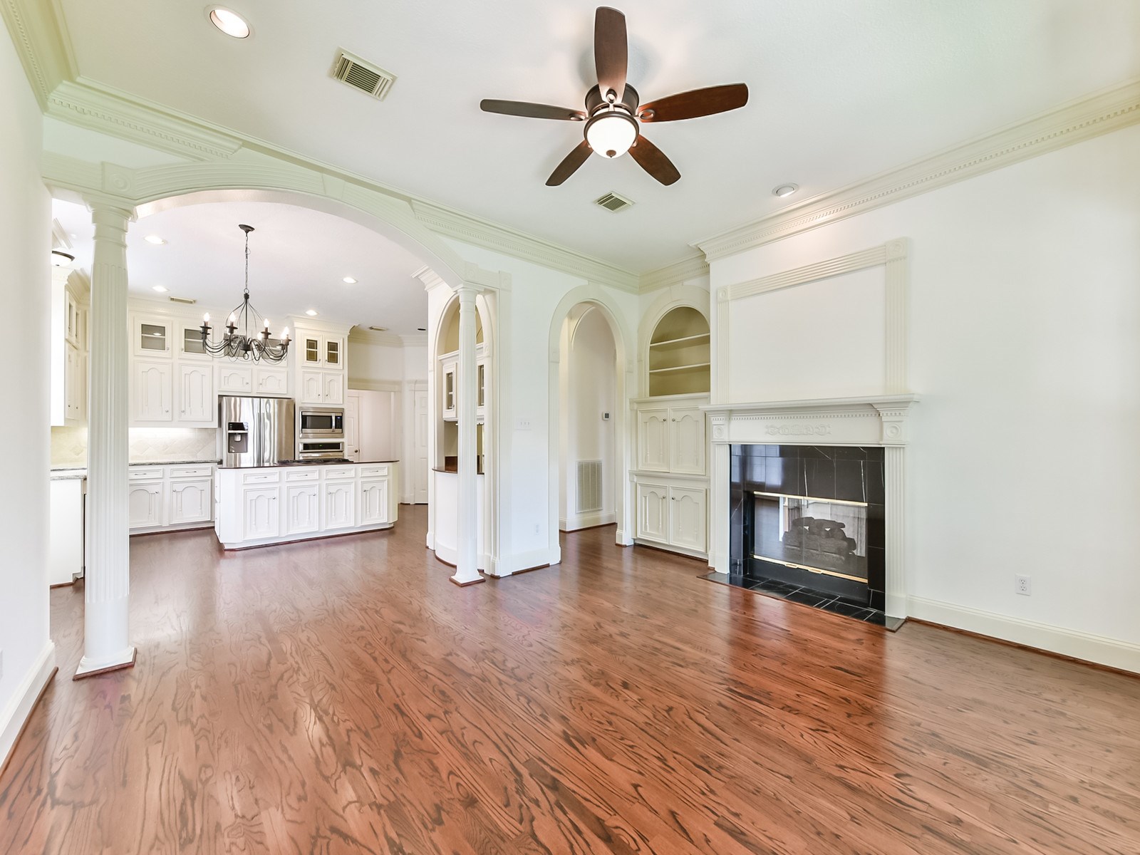 166 East Capstone Circle Spring, TX 77381 - Photo 13 of 45 a view of a kitchen with a sink and a fireplace