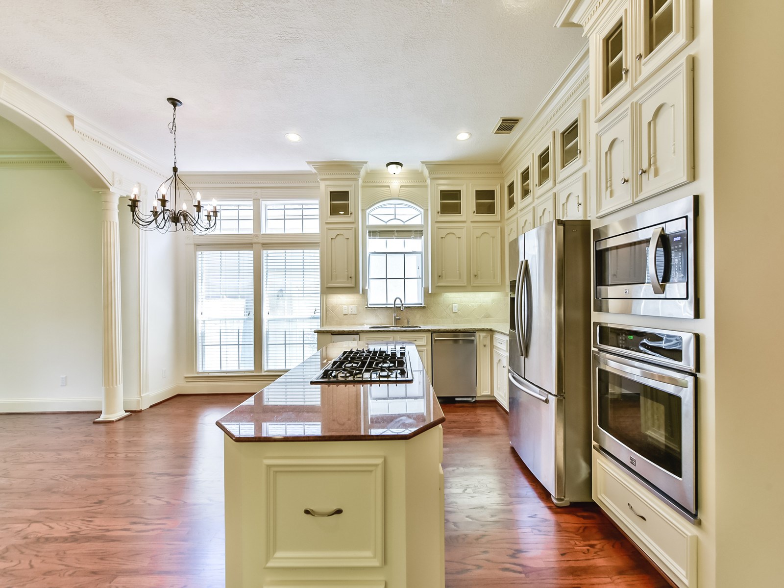 166 East Capstone Circle Spring, TX 77381 - Photo 15 of 45 a kitchen with stainless steel appliances granite countertop a stove and a refrigerator