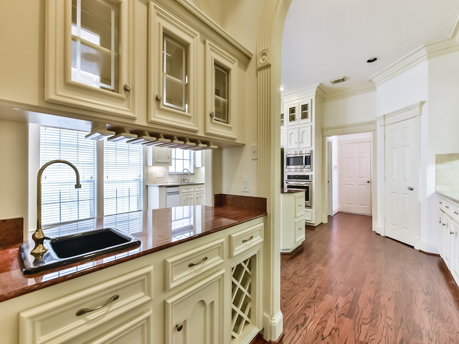 166 East Capstone Circle Spring, TX 77381 - Photo 19 of 45 a kitchen with stainless steel appliances granite countertop a stove and a wooden cabinets