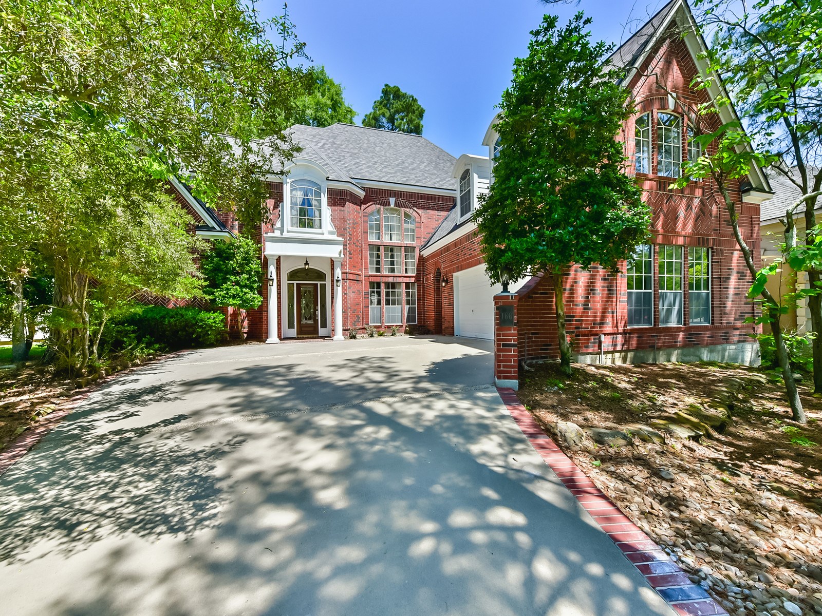 166 East Capstone Circle Spring, TX 77381 - Photo 2 of 45 a front view of a house with a tree