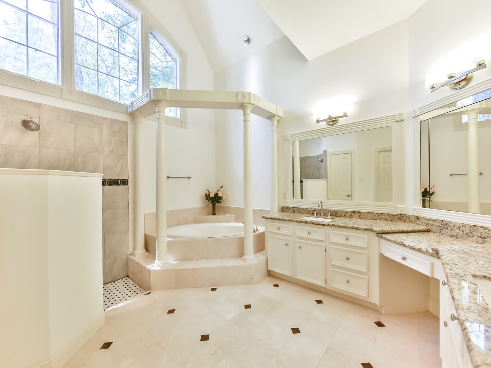 166 East Capstone Circle Spring, TX 77381 - Photo 26 of 45 a bathroom with a granite countertop sink mirror bathtub and shower