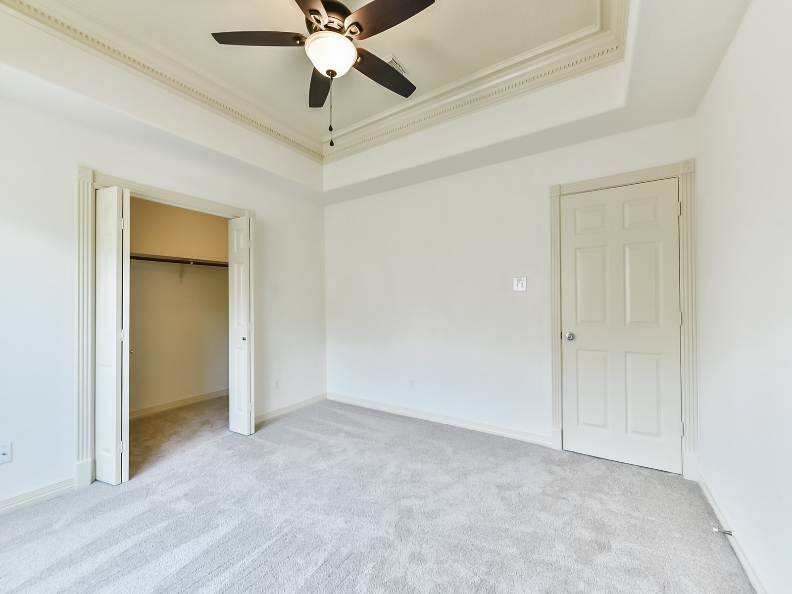 166 East Capstone Circle Spring, TX 77381 - Photo 41 of 45 an empty room with a ceiling fan and carpet